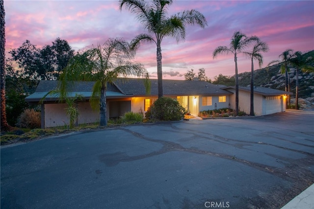 12140 Lilac Knolls Rd, Valley Center, CA 92082 - mid-century modern home featuring a garage and driveway