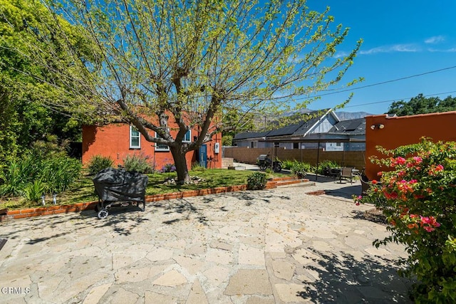 view of patio / terrace featuring fence