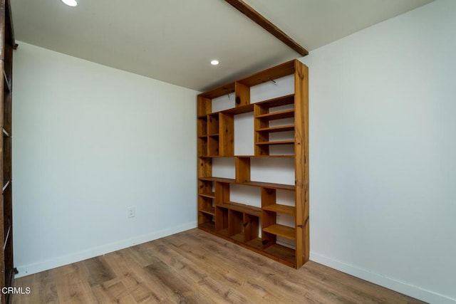 unfurnished bedroom featuring baseboards, recessed lighting, and wood finished floors