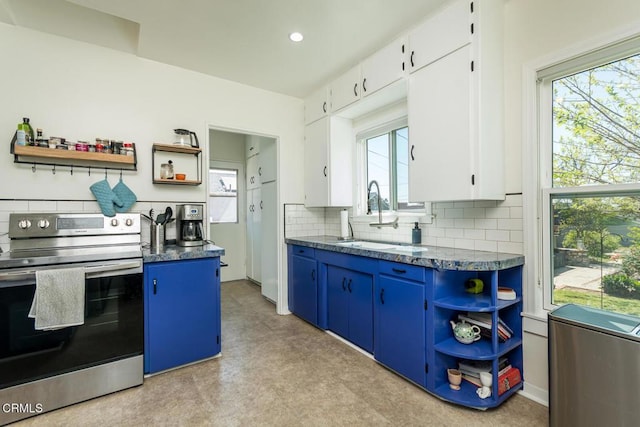 kitchen with stainless steel range with electric stovetop, a sink, open shelves, tasteful backsplash, and blue cabinetry