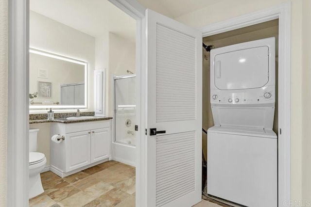 9253 Regents Unit A203, La Jolla, CA 92037 - laundry room featuring stacked washer and clothes dryer
