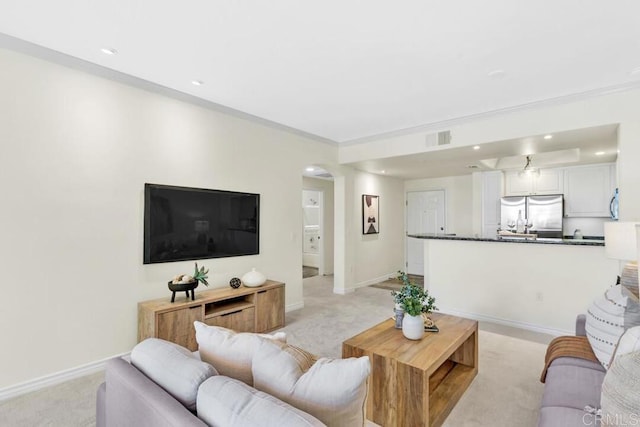 9253 Regents Unit A203, La Jolla, CA 92037 - living area with light colored carpet, arched walkways, baseboards, recessed lighting, and ornamental molding