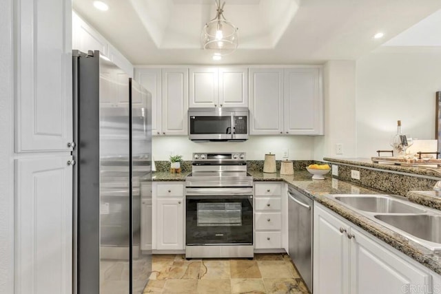 9253 Regents Unit A203, La Jolla, CA 92037 - kitchen featuring appliances with stainless steel finishes, white cabinetry, a sink, recessed lighting, and stone countertops