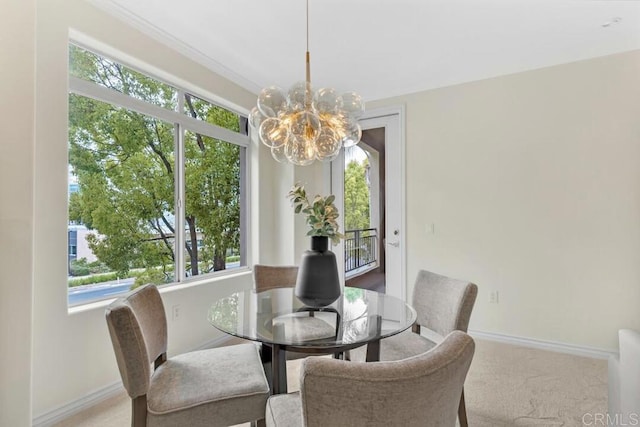 9253 Regents Unit A203, La Jolla, CA 92037 - dining room with a chandelier, baseboards, and carpet