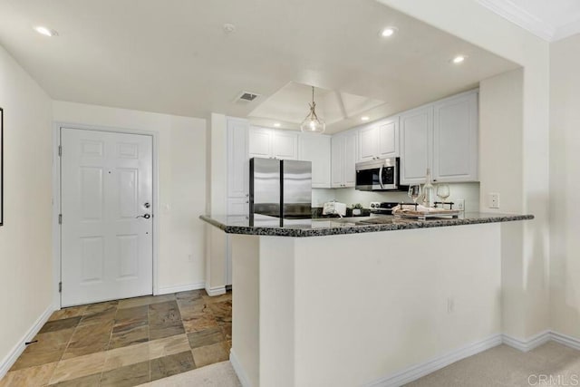 9253 Regents Unit A203, La Jolla, CA 92037 - kitchen with appliances with stainless steel finishes, baseboards, recessed lighting, white cabinets, and dark stone countertops
