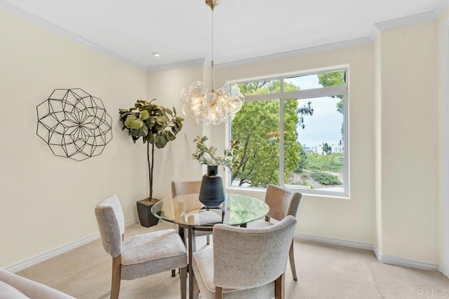 9253 Regents Unit A203, La Jolla, CA 92037 - dining area with a chandelier, light carpet, ornamental molding, and baseboards