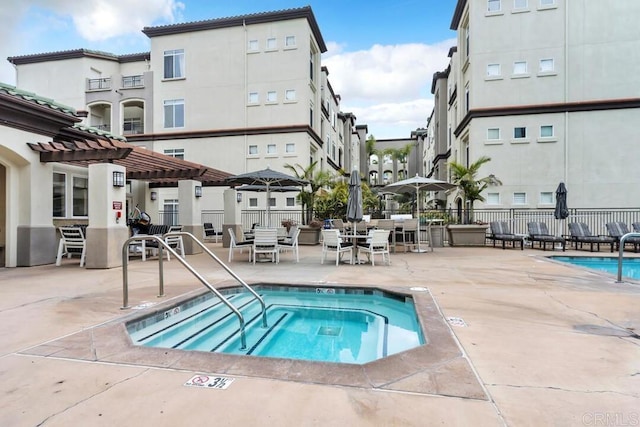 9253 Regents Unit A203, La Jolla, CA 92037 - view of swimming pool with a pergola, a community hot tub, fence, and a patio area