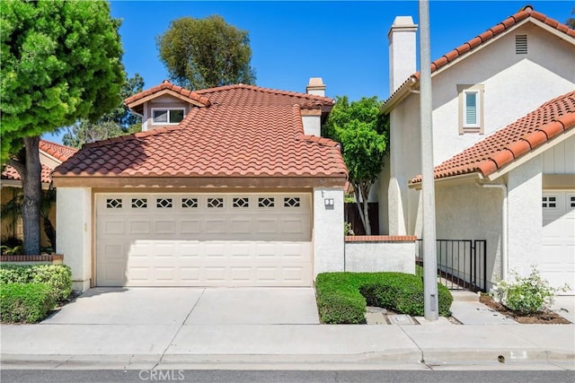 3 Terracima, Irvine, CA 92620 - mediterranean / spanish-style home with fence, stucco siding, a chimney, driveway, and a tile roof