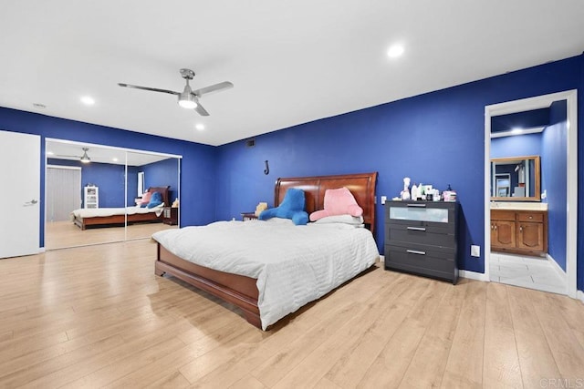 bedroom with recessed lighting, wood finished floors, ensuite bath, a closet, and ceiling fan