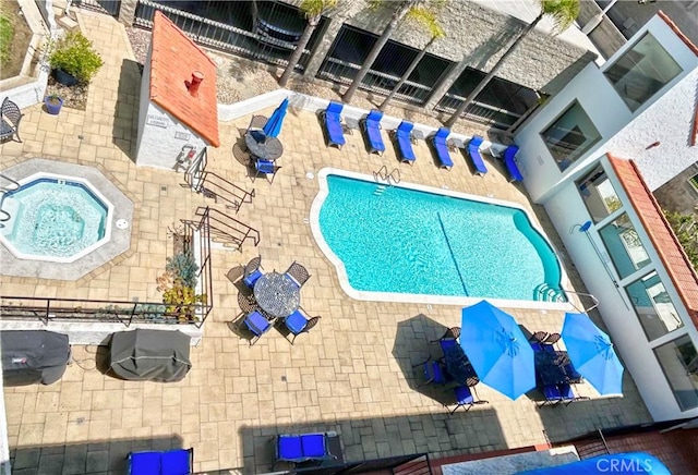 411 Avenida Granada Unit 4F, San Clemente, CA 92672 - view of swimming pool featuring a hot tub