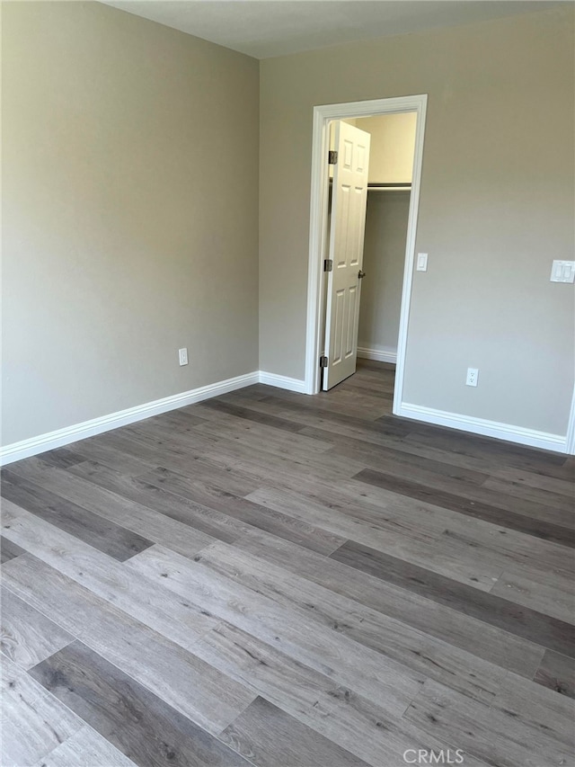 5912 Santa Ana Ave, Riverside, CA 92505 - empty room featuring baseboards and dark wood-type flooring