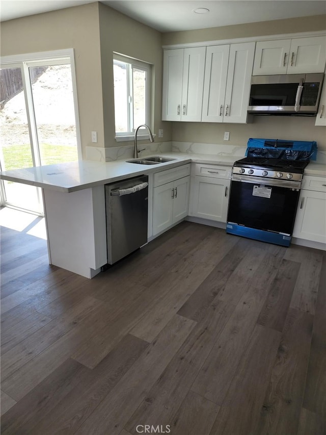 5912 Santa Ana Ave, Riverside, CA 92505 - kitchen featuring white cabinets, stainless steel appliances, light countertops, and a sink
