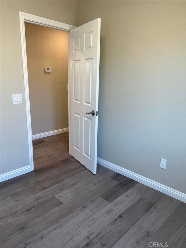 5912 Santa Ana Ave, Riverside, CA 92505 - unfurnished room with dark wood finished floors and baseboards