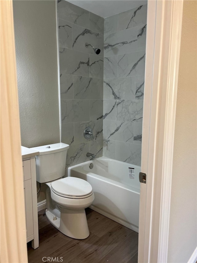 5912 Santa Ana Ave, Riverside, CA 92505 - full bathroom featuring toilet, vanity, wood finished floors, and shower / bathing tub combination