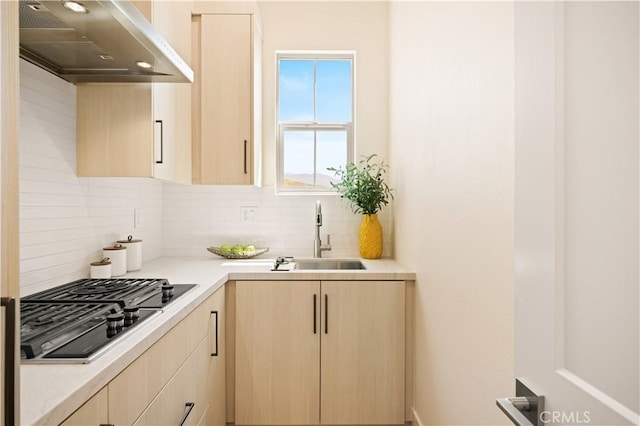128 Mossvine, Irvine, CA 92618 - kitchen with exhaust hood, backsplash, black stovetop, a sink, and light brown cabinets