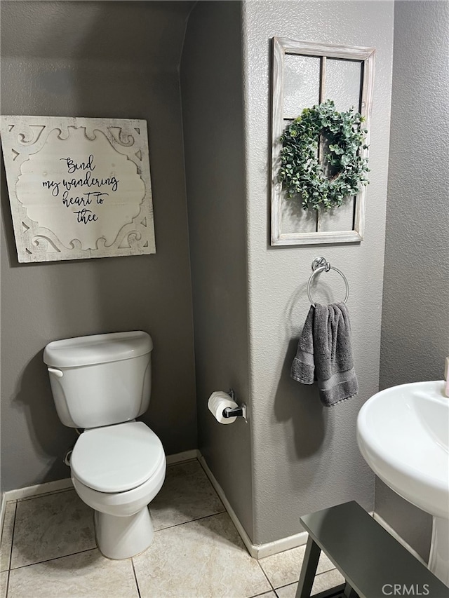 11433 Mountain View Dr Unit 62, Rancho Cucamonga, CA 91730 - half bath featuring tile patterned floors, toilet, and baseboards