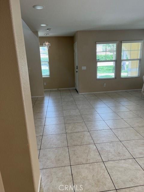 11433 Mountain View Dr Unit 62, Rancho Cucamonga, CA 91730 - unfurnished room featuring light tile patterned flooring, a chandelier, baseboards, and recessed lighting