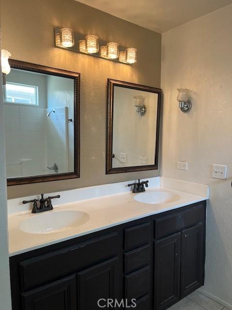 11433 Mountain View Dr Unit 62, Rancho Cucamonga, CA 91730 - full bath featuring double vanity, a shower, and tile patterned flooring
