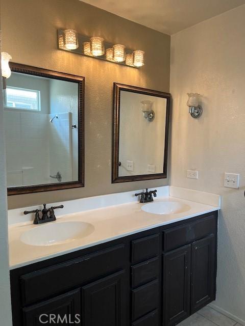 11433 Mountain View Dr Unit 62, Rancho Cucamonga, CA 91730 - full bath featuring double vanity, a shower, and tile patterned floors
