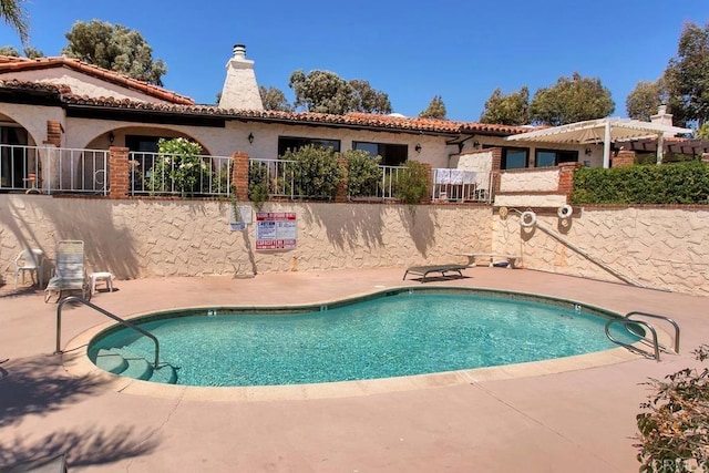 pool with a patio