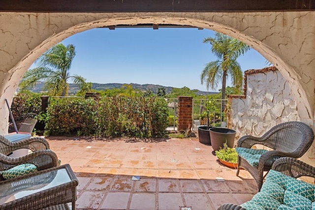 view of patio / terrace with a mountain view