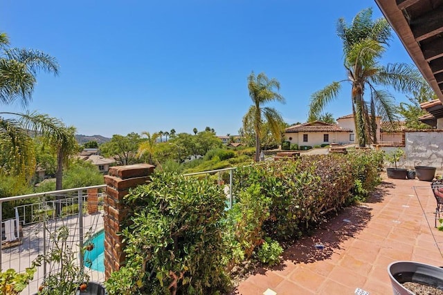 view of patio featuring a balcony