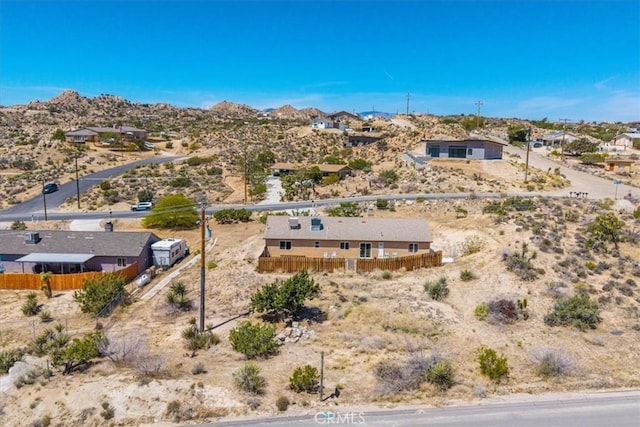 birds eye view of property with a mountain view, a rural view, and view of desert