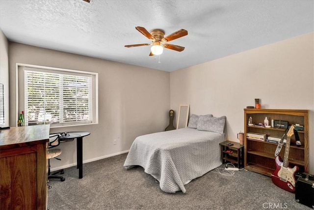 bedroom with a textured ceiling, a ceiling fan, carpet flooring, and baseboards