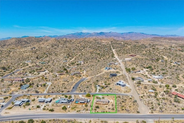 aerial view with a mountain view, a rural view, and a desert view