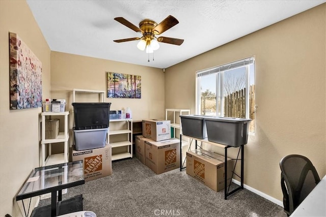 office space with ceiling fan, carpet, and baseboards
