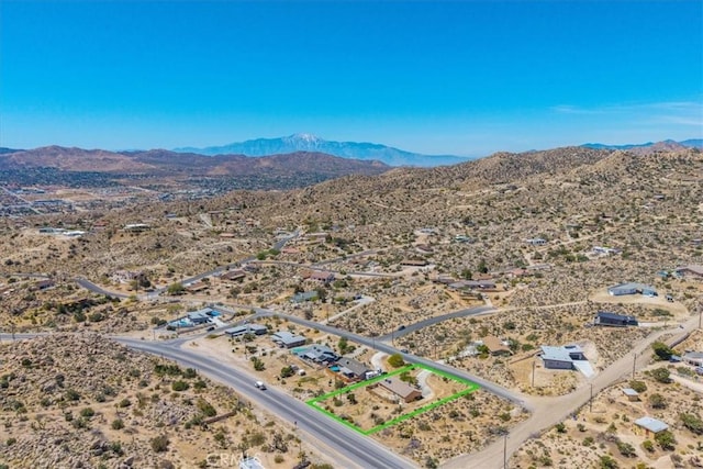 aerial view featuring view of desert, a mountain view, and a rural view