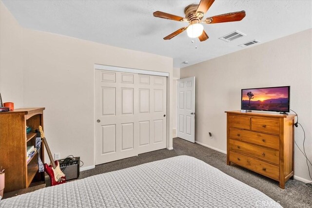 bedroom with baseboards, visible vents, a closet, and carpet flooring