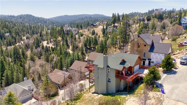 aerial view with a mountain view and a forest view