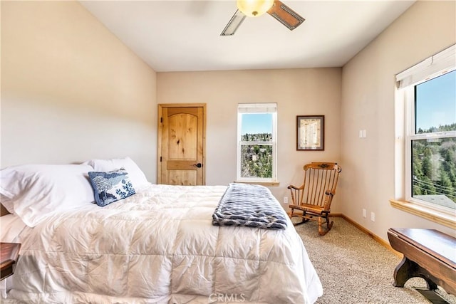 bedroom with baseboards, a ceiling fan, and carpet floors