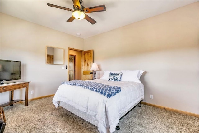 bedroom featuring baseboards, light carpet, and ceiling fan