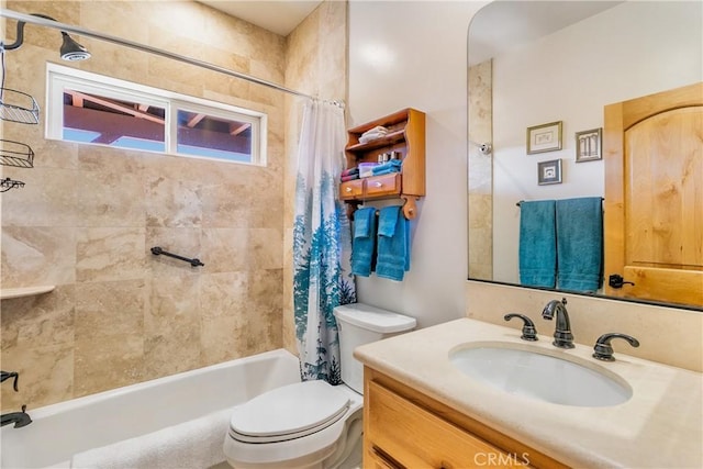 bathroom featuring shower / bath combo with shower curtain, toilet, and vanity