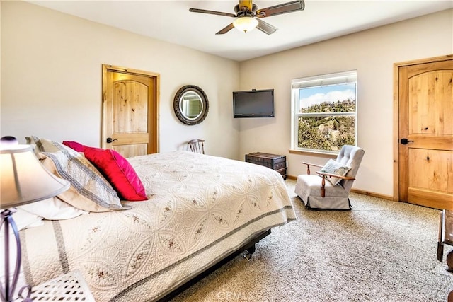 bedroom with carpet, ceiling fan, and baseboards