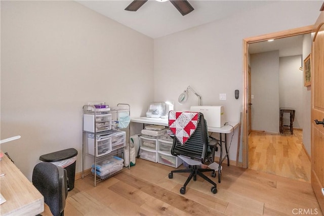 office area featuring a ceiling fan and wood finished floors