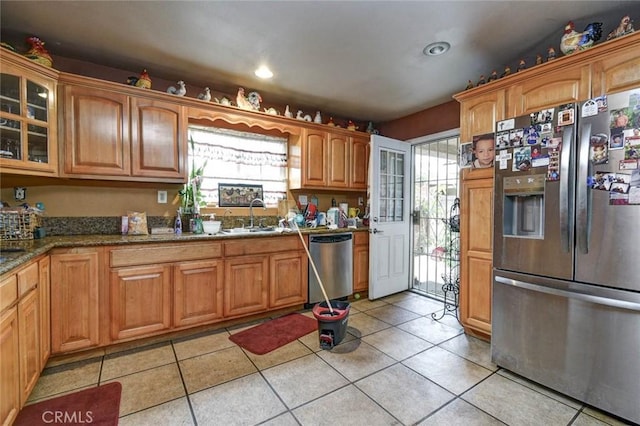 14360 Merced Ave, Baldwin Park, CA 91706 - kitchen featuring stainless steel appliances, a sink, stone countertops, glass insert cabinets, and light tile patterned flooring