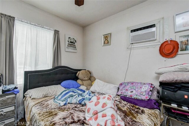 14360 Merced Ave, Baldwin Park, CA 91706 - bedroom with ornamental molding, a wall unit AC, and a ceiling fan