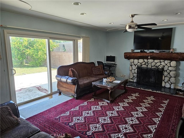 9526 Fullbright Ave, Chatsworth, CA 91311 - living room with a ceiling fan, a stone fireplace, and recessed lighting