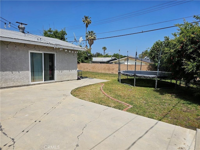 9526 Fullbright Ave, Chatsworth, CA 91311 - view of yard featuring fence, a patio area, and a trampoline