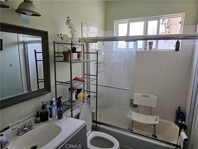 9526 Fullbright Ave, Chatsworth, CA 91311 - full bath featuring combined bath / shower with glass door, vanity, and toilet
