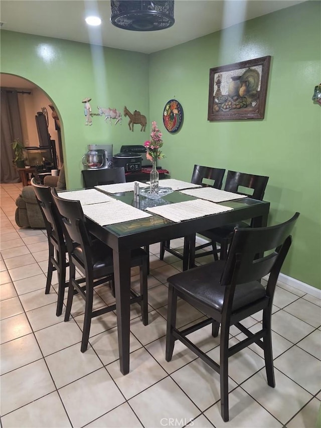 2998 Mary St, Riverside, CA 92506 - dining area with arched walkways and light tile patterned floors