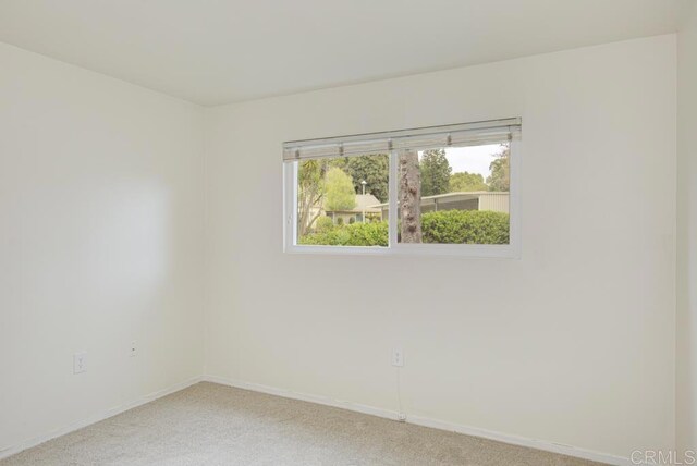 3168 Via Vis Unit B, Laguna Woods, CA 92637 - unfurnished room with light carpet and baseboards
