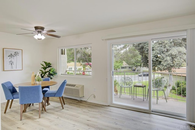 3168 Via Vis Unit B, Laguna Woods, CA 92637 - dining area featuring a ceiling fan, baseboards, wood finished floors, and a wall mounted AC