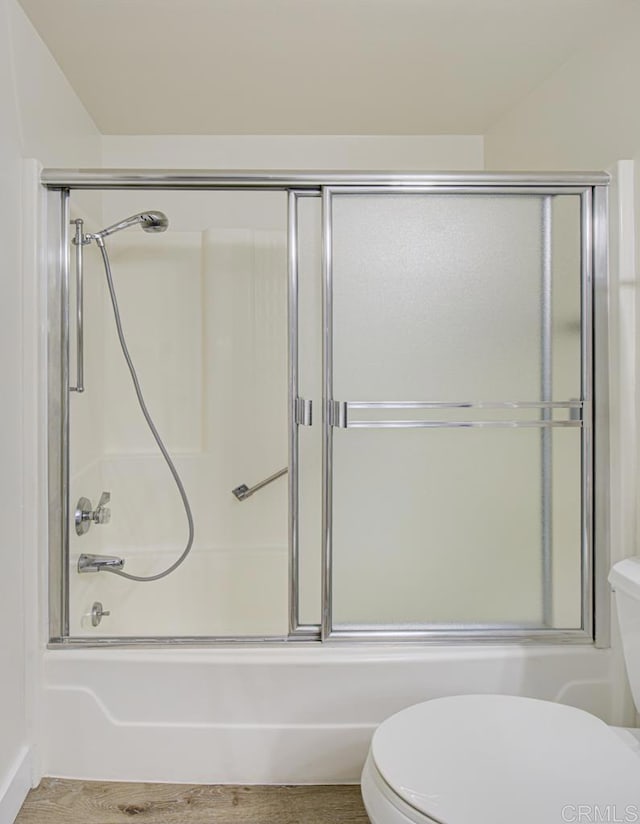 3168 Via Vis Unit B, Laguna Woods, CA 92637 - full bathroom with toilet, bath / shower combo with glass door, and wood finished floors