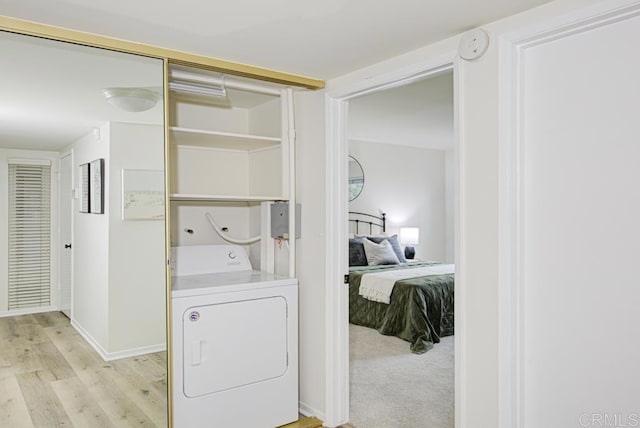 3168 Via Vis Unit B, Laguna Woods, CA 92637 - washroom featuring washer / dryer and light wood-style flooring