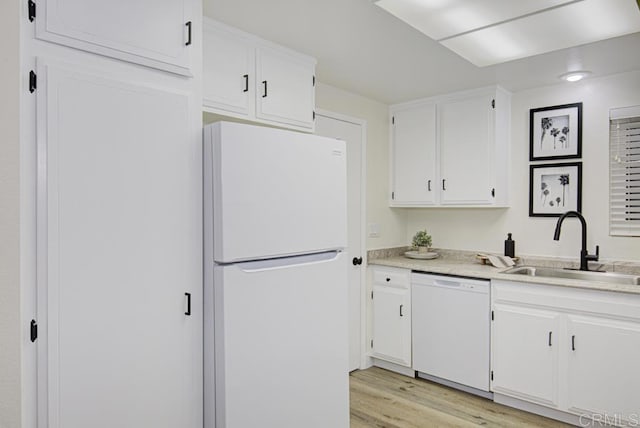 3168 Via Vis Unit B, Laguna Woods, CA 92637 - kitchen with white appliances, a sink, light wood-style floors, white cabinets, and light countertops