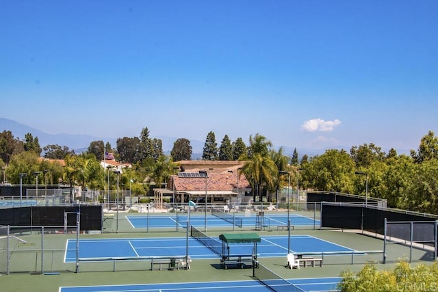 3168 Via Vis Unit B, Laguna Woods, CA 92637 - view of tennis court with a mountain view